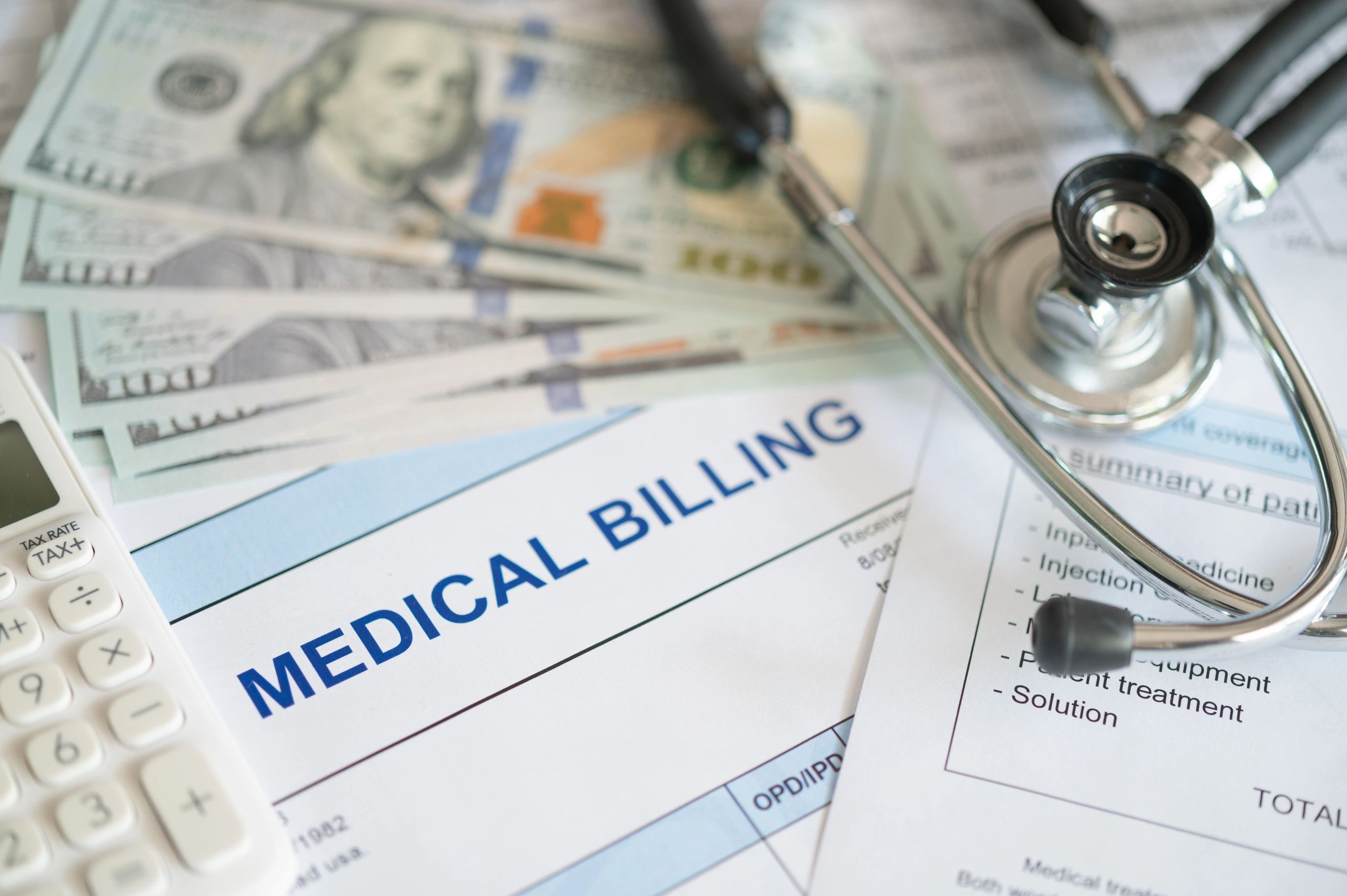 Medical billing documents with stethoscope representing healthcare pricing